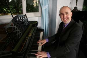 Stuart playing the piano