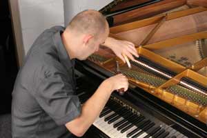 stuart restoring a piano